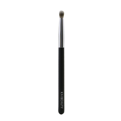 Dome-shaped eye brush with soft vegan bristles, perfect for precise contouring and intense color application.