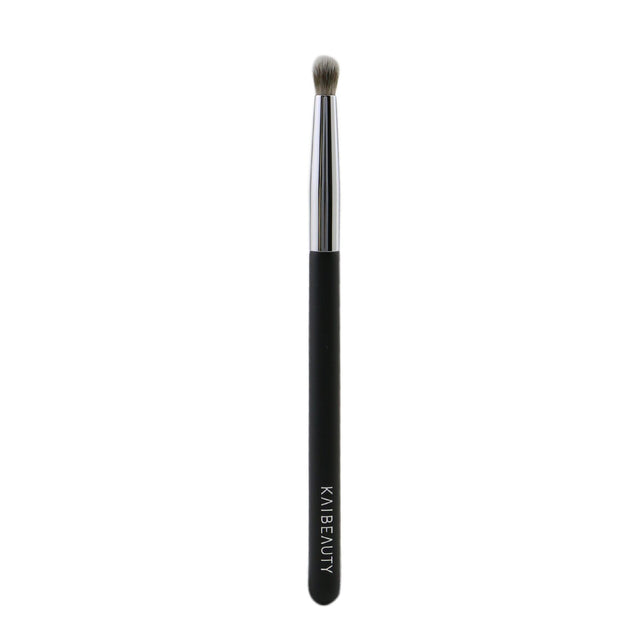 Dome-shaped eye brush with soft vegan bristles, perfect for precise contouring and intense color application.