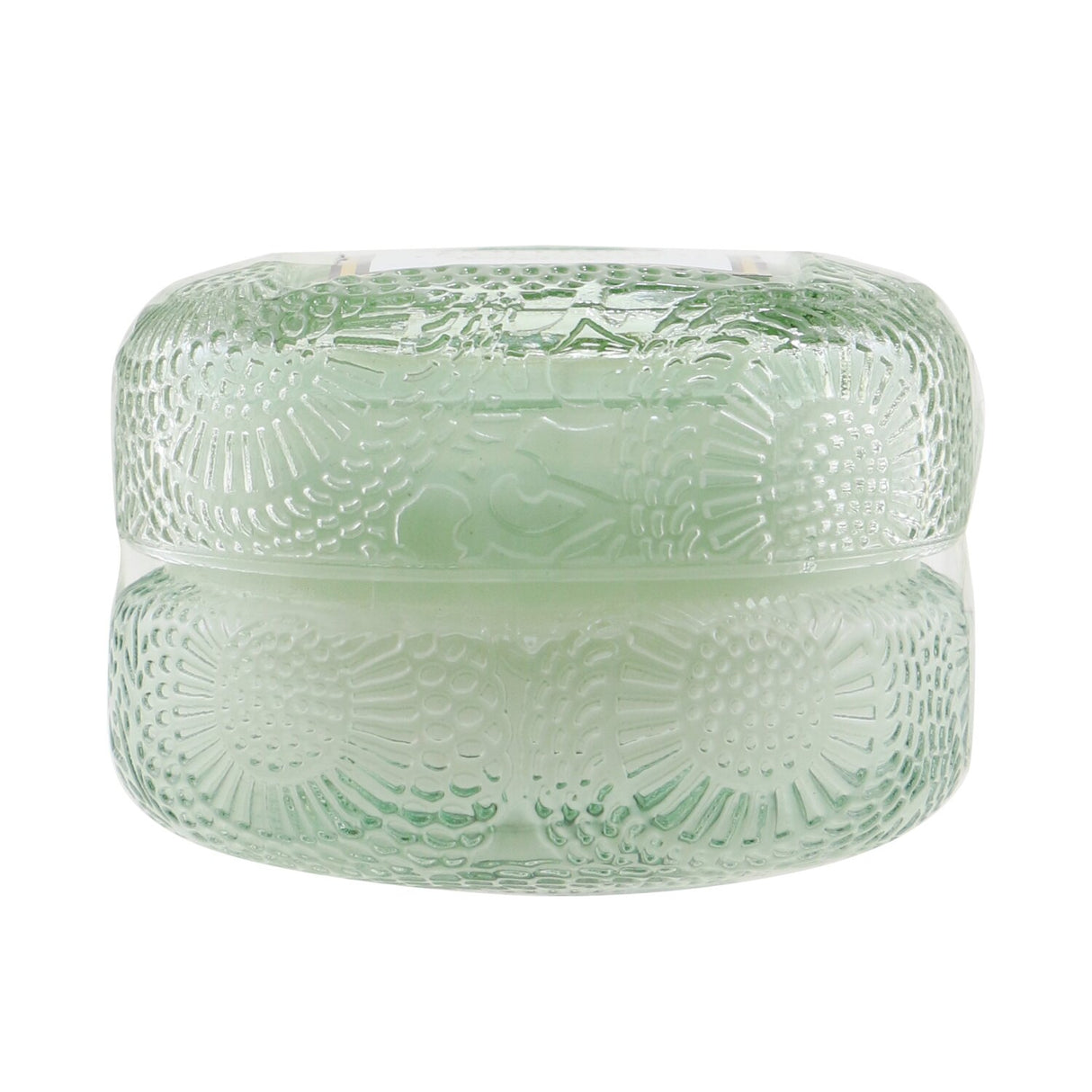 Petite Voluspa Macaron Candle in French Cade Lavender, eco-friendly and elegantly housed in a geometric glass container.