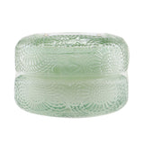 Petite Voluspa Macaron Candle in French Cade Lavender, eco-friendly and elegantly housed in a geometric glass container.