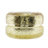 Luxurious Voluspa Macaron Candle in textured glass, featuring the warm scents of pomander and hinoki, burns for 15 hours.