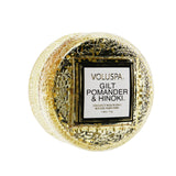 Elegant Voluspa Macaron Candle in Gilt Pomander & Hinoki, housed in a textured glass jar with a warm, inviting aroma.