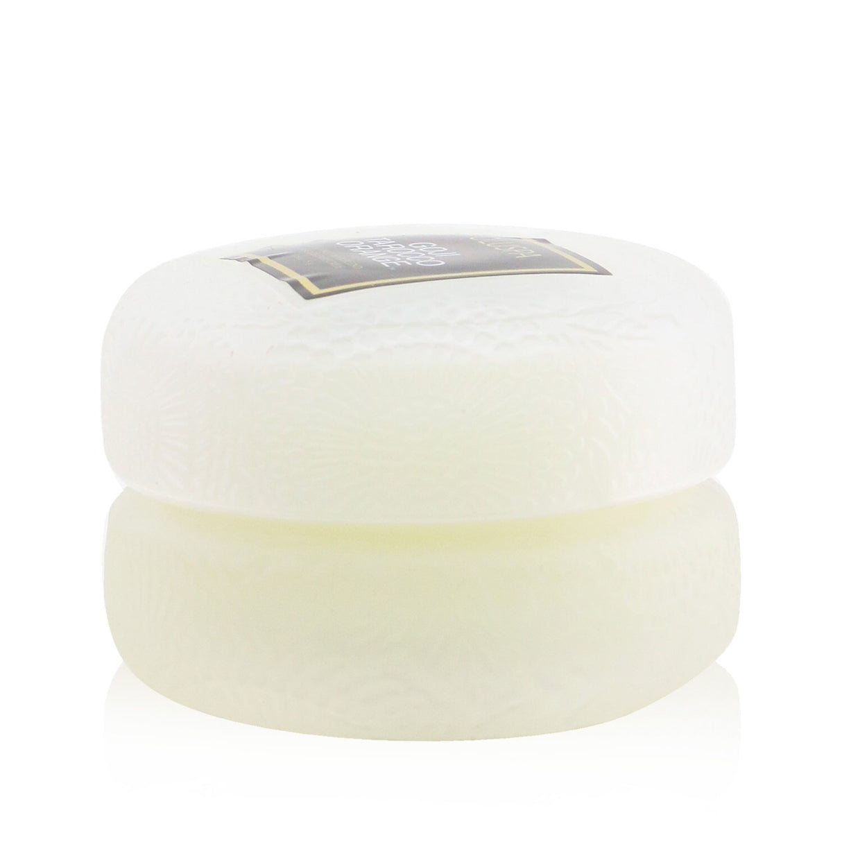 Elegant Voluspa Macaron Candle in Spiced Goji Tarocco Orange, featuring geometric glass, natural wicks, and a 15-hour burn time.