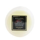Elegant Voluspa Macaron Candle in Spiced Goji Tarocco Orange with geometric glass container and 15-hour burn time.
