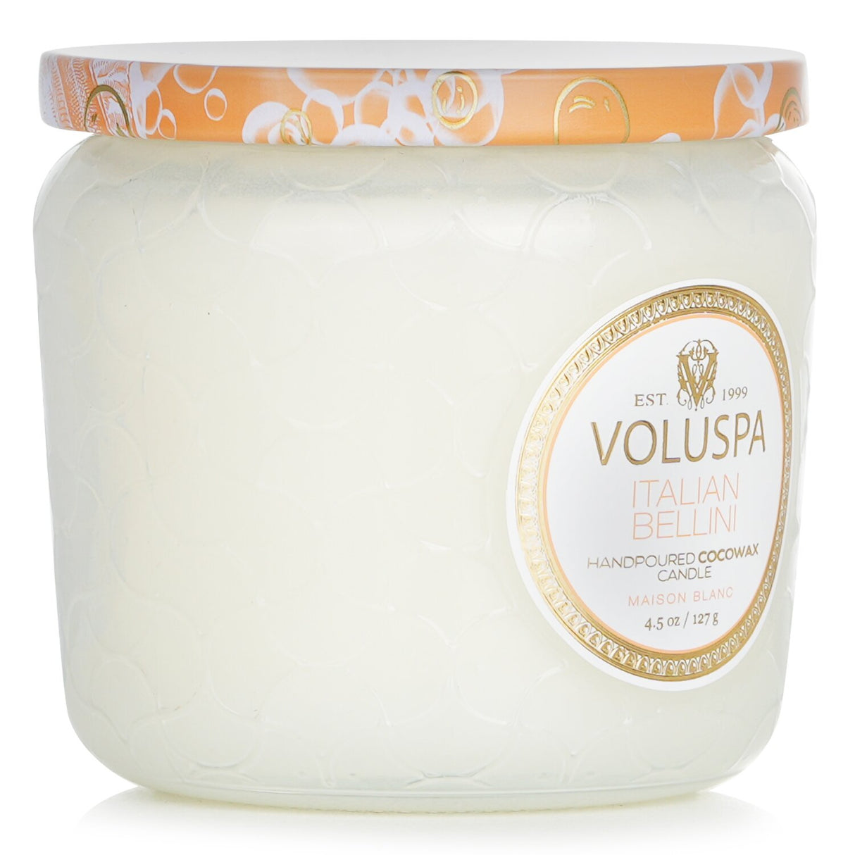 A petite jar candle in Italian Bellini scent, featuring sweet peach and sparkling champagne, elegantly presented in a decorative glass jar.