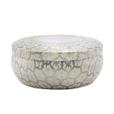 Luxurious Voluspa 3 Wick Candle in Suede Blanc, housed in a decorative metallic tin, providing a soft, inviting aroma.