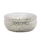 Luxury 3-wick candle in a jewel-toned tin, emitting a soft Suede Blanc fragrance for a warm, inviting ambiance.