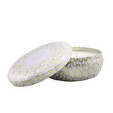 Luxurious Voluspa 3 Wick Decorative Tin Candle in Suede Blanc, featuring a coconut wax blend and rich jewel-toned metallic tin.