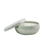 Voluspa 3 Wick Tin Candle in Laguna, featuring coconut wax, floral notes, and intricate metallic design for elegant decor.