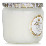 Voluspa Petite Jar Candle in Suede Blanc, 127g, features a luxurious coconut wax blend in an elegant embossed glass container.