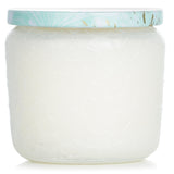 Voluspa Petite Jar Candle in Laguna, a 127g eco-friendly candle in an embossed glass jar, offers a refreshing ocean breeze scent.