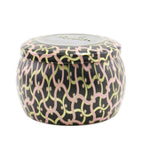 Mini tin candle in pink citron grapefruit scent, elegantly designed with a coconut wax blend and natural wicks for a clean burn.