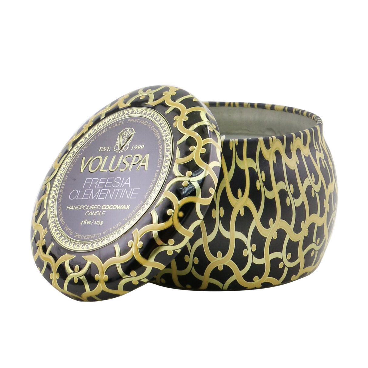 Mini Voluspa tin candle in Freesia Clementine, featuring elegant design and a 25-hour coconut wax blend burn time.
