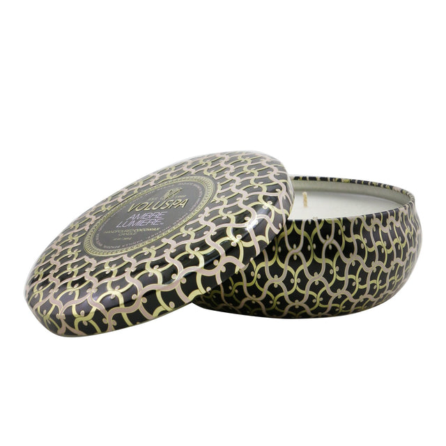 Voluspa 3 Wick Decorative Tin Candle in Ambre Lumiere, featuring a rich amber scent and elegant metallic jewel-tone design.
