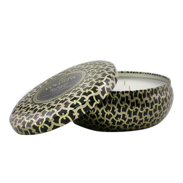 Voluspa Suede Noir tin candle with 3 wicks, coconut wax blend, rich jewel-toned design, 40-hour burn time.