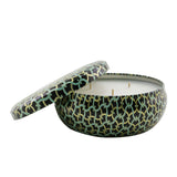Voluspa's French Linen 3 Wick Candle in a decorative metallic tin, offering a luxurious scent and 40-hour burn time.