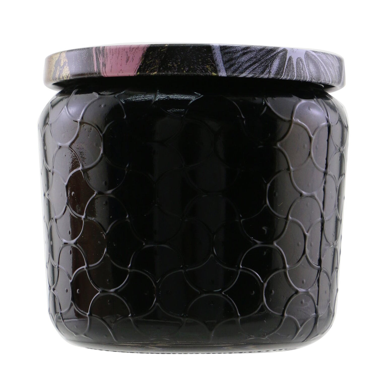 Bright pink grapefruit-scented Voluspa Petite Jar Candle in a decorative glass, featuring a cozy atmosphere for any room.