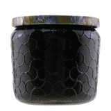 Voluspa Freesia Clementine Petite Jar Candle in an embossed glass container, offering 35 hours of enchanting floral and citrus aroma.