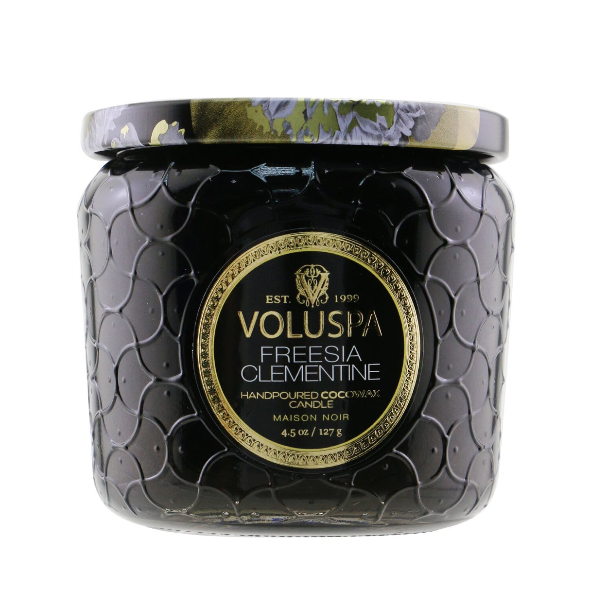 Voluspa Petite Jar Candle in Freesia Clementine, featuring a floral-citrus scent in a decorative glass container.