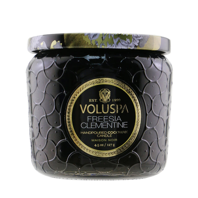Voluspa Petite Jar Candle in Freesia Clementine, featuring a floral-citrus scent in a decorative glass container.