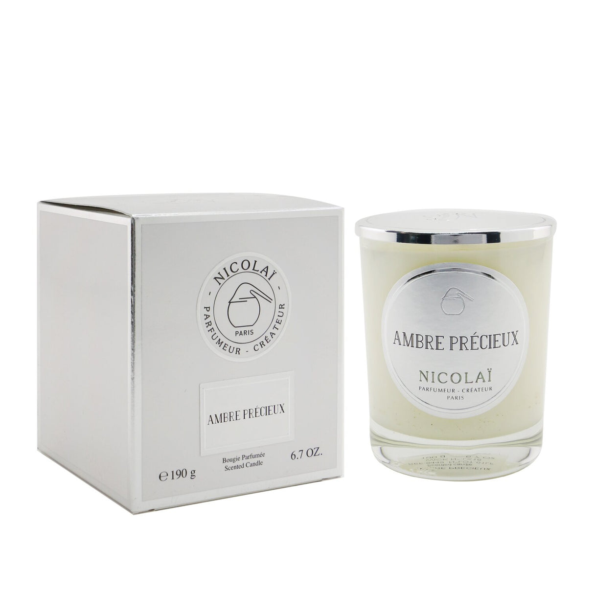 Nicolai Ambre Précieux scented candle in elegant glass, offering 50 hours of soft fragrance for tranquil home ambiance.