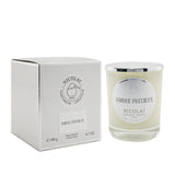 Nicolai Ambre Précieux scented candle in elegant glass, offering 50 hours of soft fragrance for tranquil home ambiance.