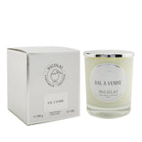 "Nicolai Bal A Venise scented candle in a stylish glass jar, offering a soothing fragrance and 50 hours of burn time."