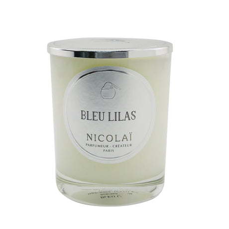 Nicolai Bleu Lilas scented candle in a glass container, offering 50 hours of lilac fragrance for a relaxing ambiance.