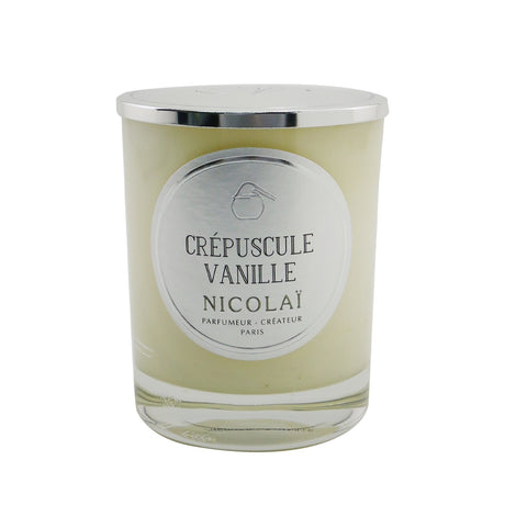 Nicolai Crepuscule Vanille scented candle in elegant glass, emits soothing vanilla fragrance, burns for up to 50 hours.