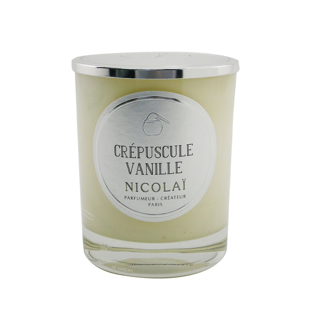 Nicolai Crepuscule Vanille scented candle in elegant glass, emits soothing vanilla fragrance, burns for up to 50 hours.