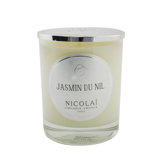 Elegant Nicolai scented candle in a stylish glass container, featuring a soothing jasmine fragrance with a 50-hour burn time.