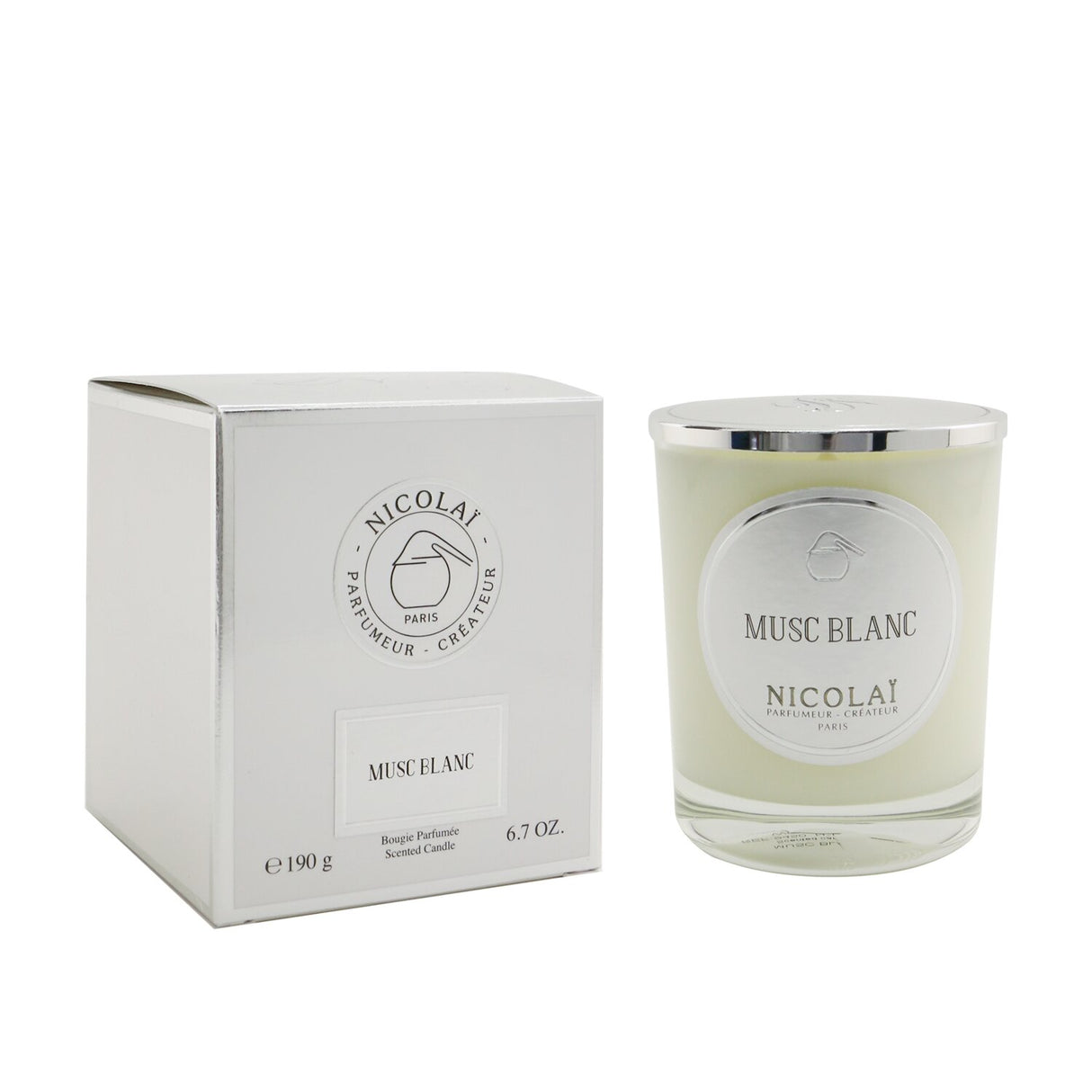 Elegant Nicolai Musc Blanc scented candle in a glass container, offers a warm aroma and 50-hour burn time for relaxation.