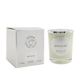 Elegant Nicolai Musc Blanc scented candle in a glass container, offers a warm aroma and 50-hour burn time for relaxation.