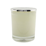 Nicolai Musc Blanc scented candle in a stylish glass container, emitting a warm, inviting fragrance for up to 50 hours.