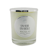 Elegant Nicolai scented candle in a glass container, offering a comforting fragrance inspired by serene Sicilian evenings.