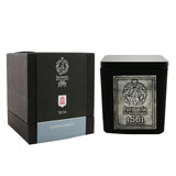 Farmacia Santissima Annunziata Seta scented candle in an elegant glass vase, perfect for creating a warm, cozy atmosphere.