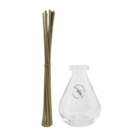 Droplet-shaped glass diffuser from L'Occitane enhances home fragrance with elegant design and soothing aroma.