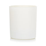 Cowshed Relax Candle in 220g jar, filled with calming chamomile and eucalyptus scent for a peaceful ambiance.