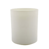 Cowshed Replenish Candle in a glass jar, featuring citrusy scents of Red Mandarin and Grapefruit for an uplifting ambiance.