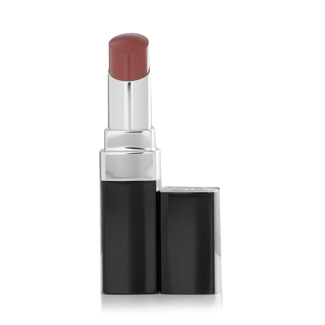 Chanel Rouge Coco Bloom #112 Opportunity lipstick in a sleek case, offering hydrating shine and long-lasting color.