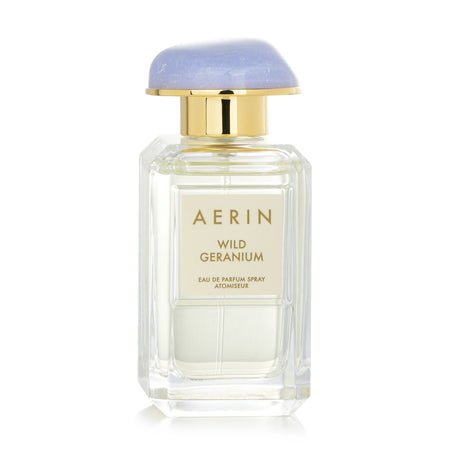 Luxurious floral woody perfume for women with notes of geranium, lemon, and rose, ideal for spring and summer.