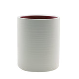 Miller Harris Petal Storm Candle in a 250g jar, featuring a citrus floral scent and 40-hour burn time for a serene ambiance.