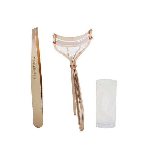 Rose gold beauty gift set featuring a slant tweezer for precise brow shaping and a classic lash curler with replacement pads.