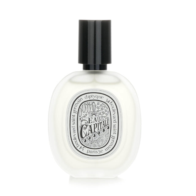 Weightless Diptyque Eau Capitale Hair Mist in a 30ml bottle, infused with camellia oil for fragrance and hydration.