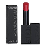 ADDICTION lip color #012, creamy and vibrant, offers extreme shine with botanical oils for a luxurious, dewy finish.