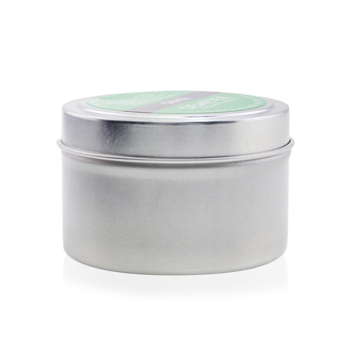 Handcrafted soy candle in Grass scent, 170g, creating a calming atmosphere with fresh, inviting fragrance and warm candlelight.