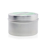 Handcrafted soy candle in Grass scent, 170g, creating a calming atmosphere with fresh, inviting fragrance and warm candlelight.
