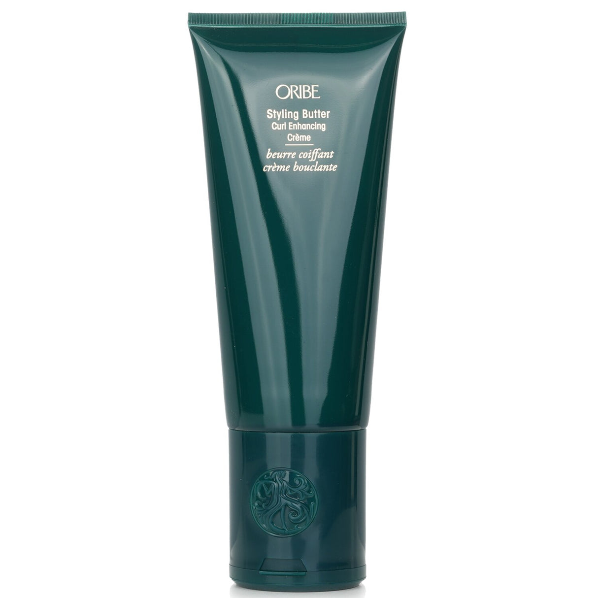 Oribe Styling Butter Curl Enhancing Crème enhances curls and coils with hydration, reducing frizz for a bouncy, defined look.