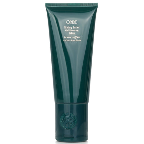 Oribe Styling Butter Curl Enhancing Crème enhances curls and coils with hydration, reducing frizz for a bouncy, defined look.