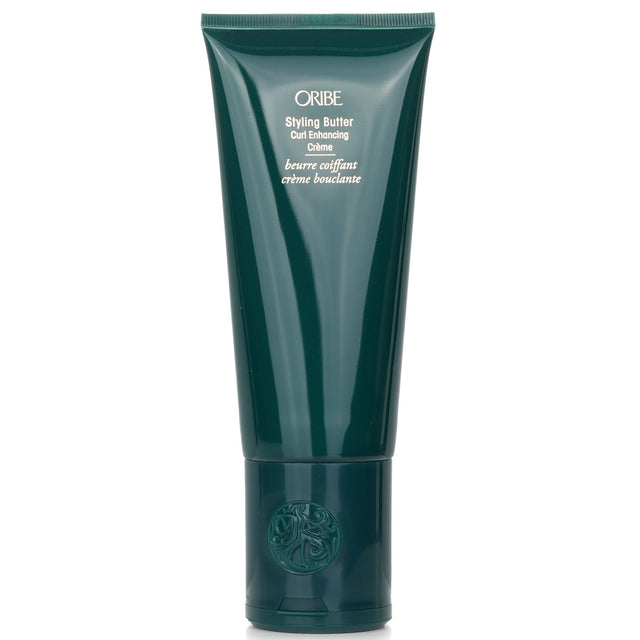 Oribe Styling Butter Curl Enhancing Crème enhances curls and coils with hydration, reducing frizz for a bouncy, defined look.